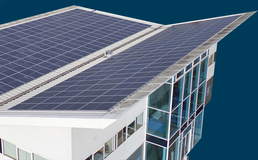 Solar installation workers in high-visibility jackets inspecting solar panels